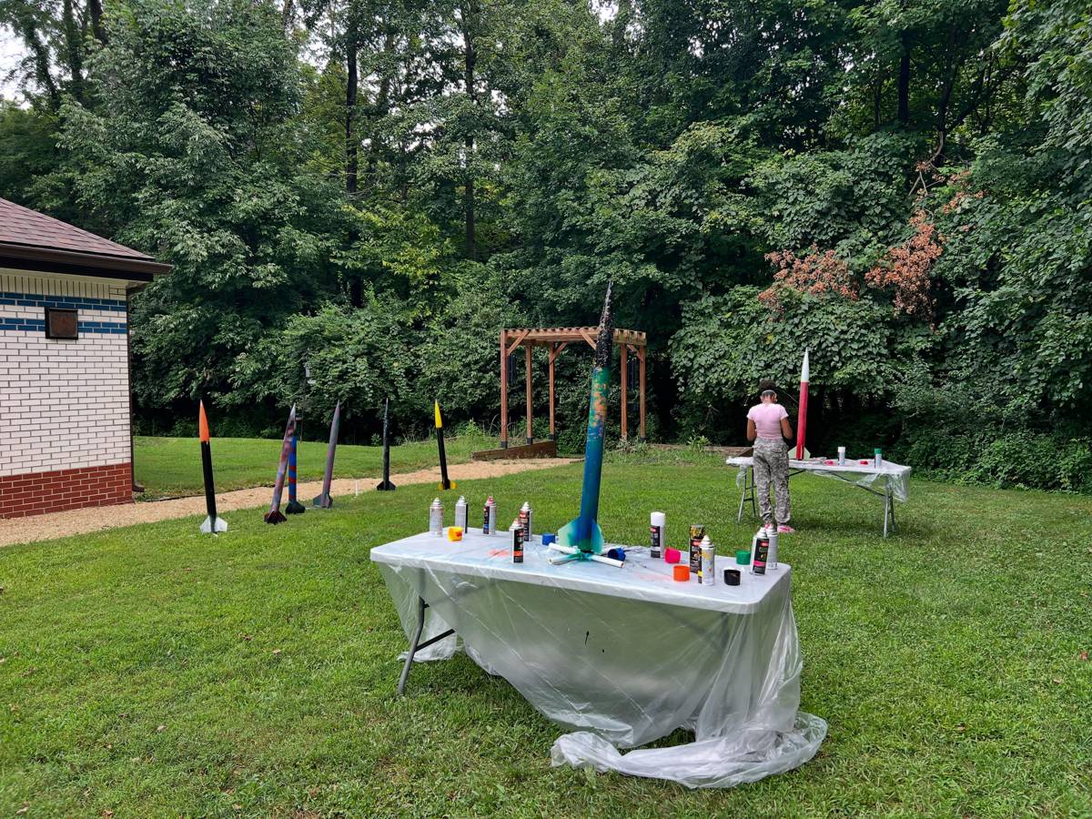 Freshly painted student rockets drying